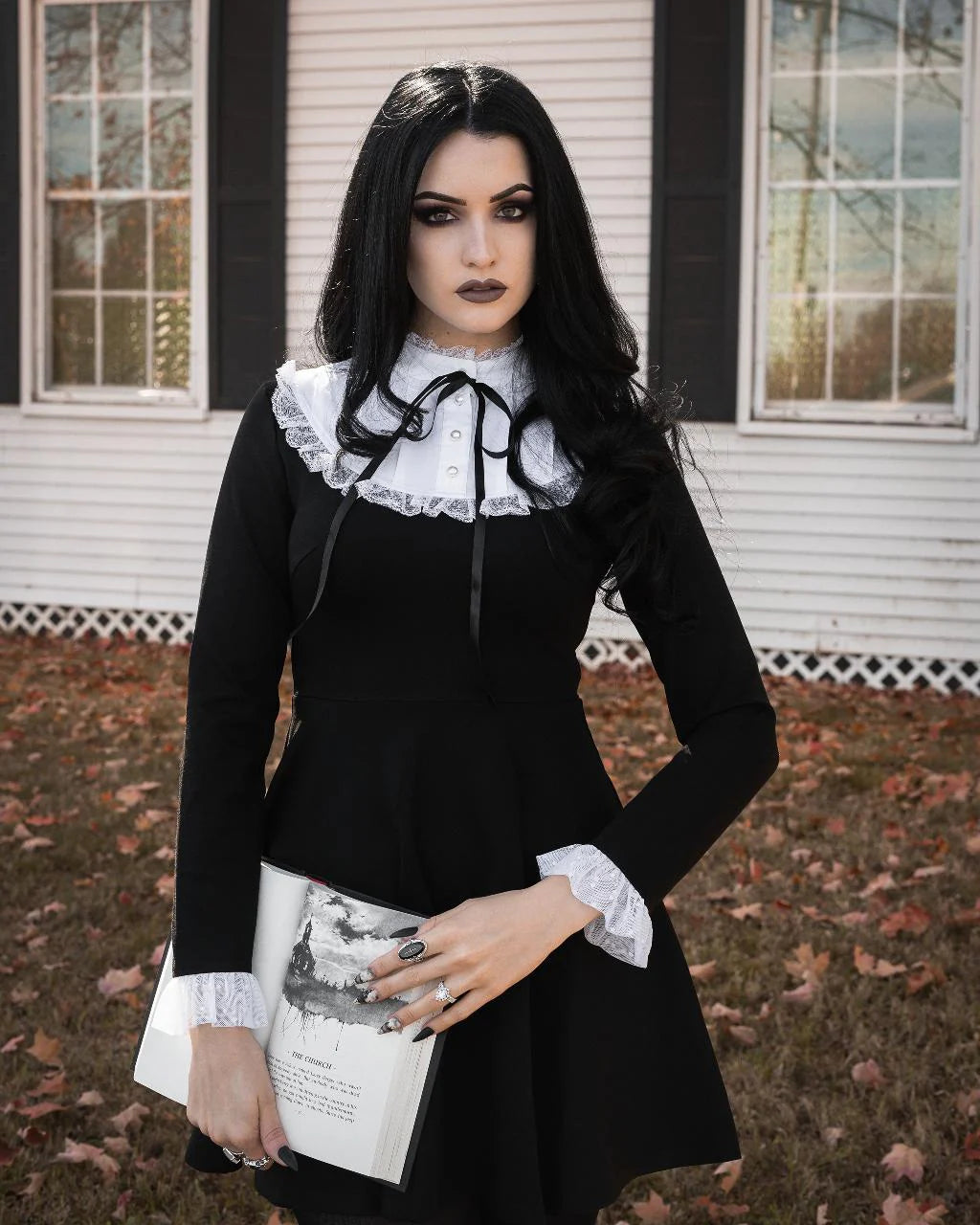 Black flared mini dress with a round neck and white ruffle - Salem Black flared mini dress with a round neck and white ruffle - Salem
